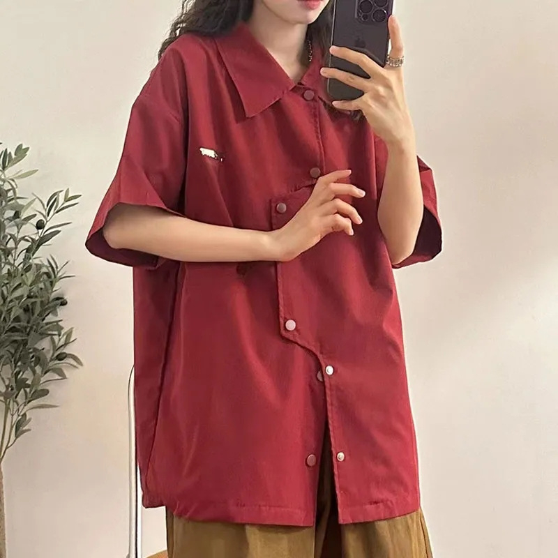 Ženska košulja s kratkim rukavima, nepravilnog kroja, poliester, polo ovratnik, kopčanje na jedan red