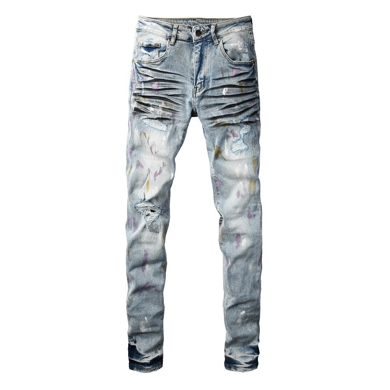 Traperice s poderotinama i graffiti zakrpama, uski kroj, rastezljivi denim