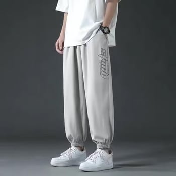 Férfi cropped jogger nadrág, laza szabás, középtalpú derék, poliészter anyag, mikroelasztikusság