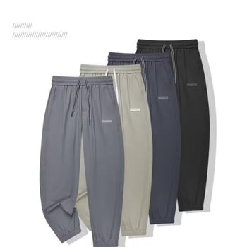 Férfi cropped jogger nadrág, laza szabás, középtalpú derék, poliészter anyag, mikroelasztikusság