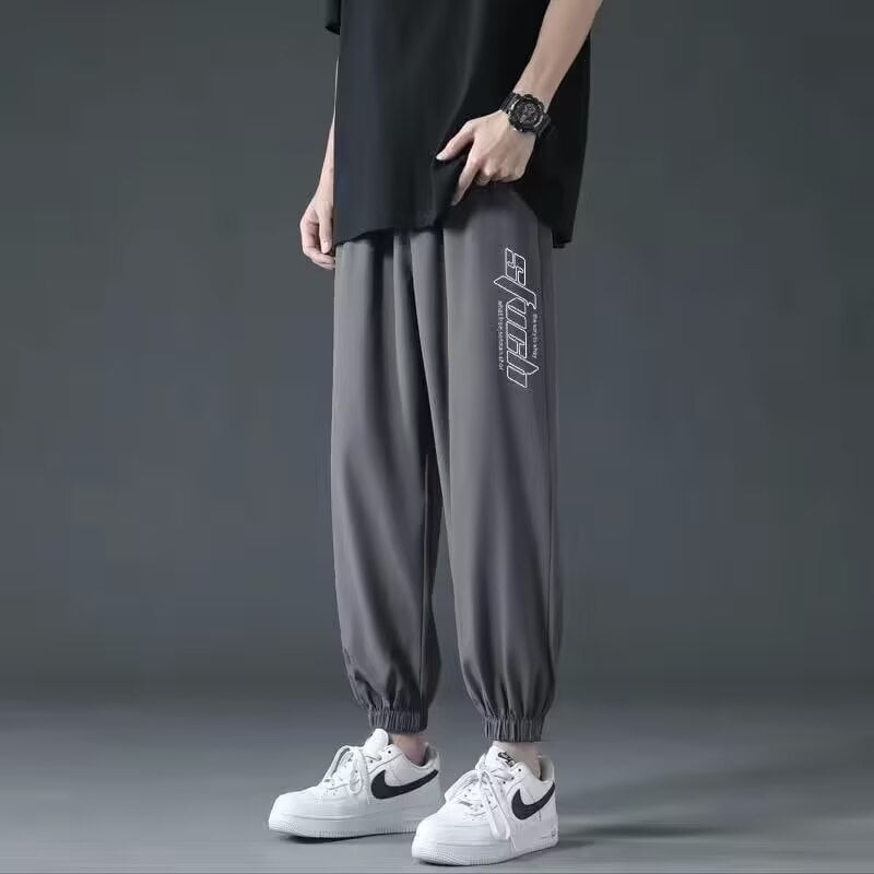 Férfi cropped jogger nadrág, laza szabás, középtalpú derék, poliészter anyag, mikroelasztikusság