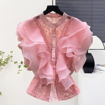 Csipke anyagú ing, álló gallérral, egy sor gombbal, rövid ujjú, egyenes szabású, hossz 50–65 cm, egyszínű modell, japán-koreai lazább stílus