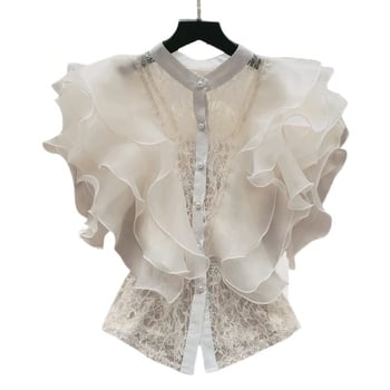 Csipke anyagú ing, álló gallérral, egy sor gombbal, rövid ujjú, egyenes szabású, hossz 50–65 cm, egyszínű modell, japán-koreai lazább stílus