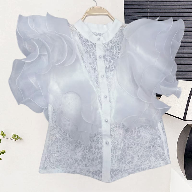 Csipke anyagú ing, álló gallérral, egy sor gombbal, rövid ujjú, egyenes szabású, hossz 50–65 cm, egyszínű modell, japán-koreai lazább stílus