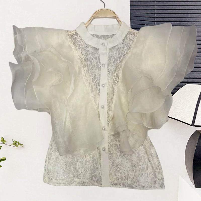 Csipke anyagú ing, álló gallérral, egy sor gombbal, rövid ujjú, egyenes szabású, hossz 50–65 cm, egyszínű modell, japán-koreai lazább stílus