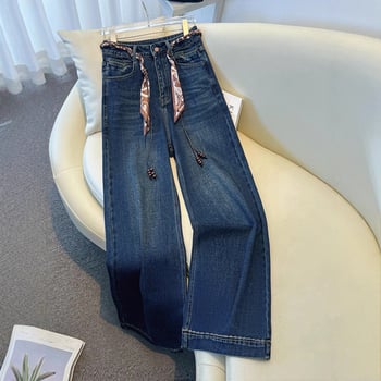 Széles lábú farmernadrág magas derékkal, selyemsál övvel, padlót érő hosszúság, tél 2025