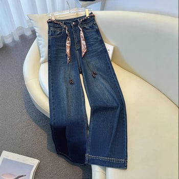 Széles lábú farmernadrág magas derékkal, selyemsál övvel, padlót érő hosszúság, tél 2025