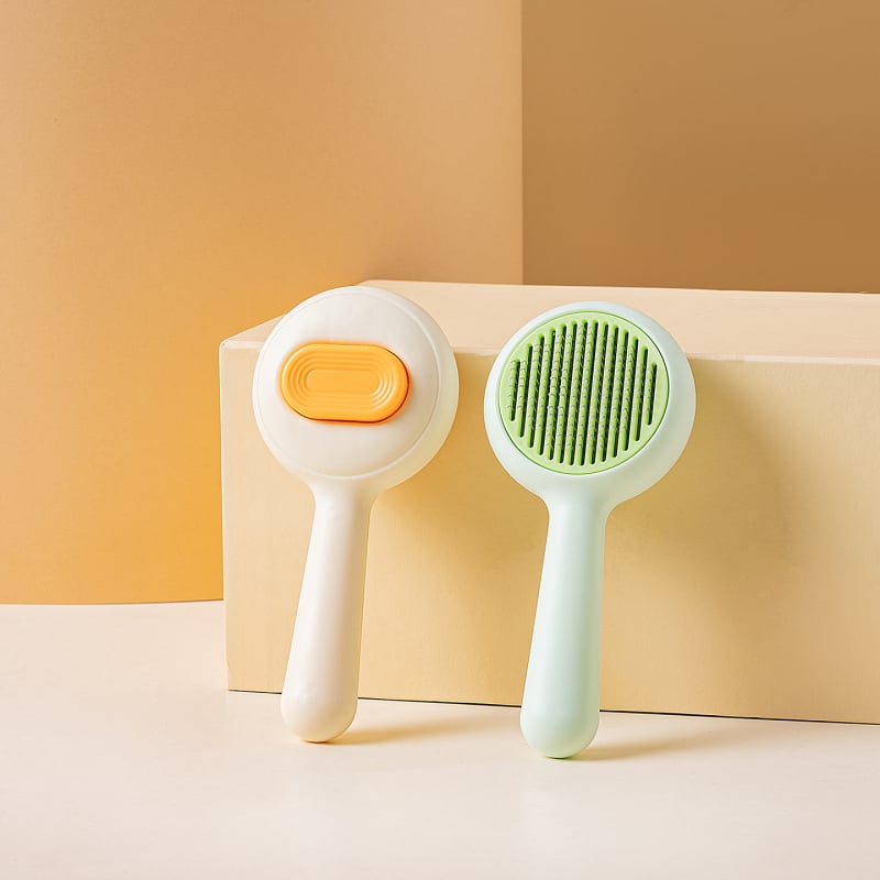 Macska- és kutyaápoló kefe a gubancok oldására és a szőr eltávolítására, kerek formájú kisállat-szőrkefe (Anyag: Műanyag; Termékkód: TQ-CW-093; Alkalmazható: Univerzális)