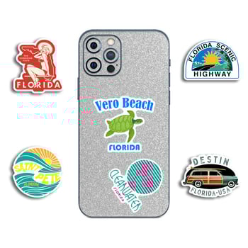 50 darab PVC matrica Florida városainak látképét ábrázoló karikatúra stílusban, nyomtatott kivitelben; poggyászra és telefontokokra.