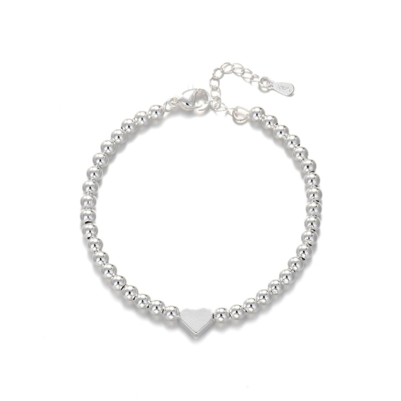 Réz alapú karkötő ezüstös bevonattal, szív alakú golyógyöngyök, női minimalist stílus, márka: Three Silversmiths