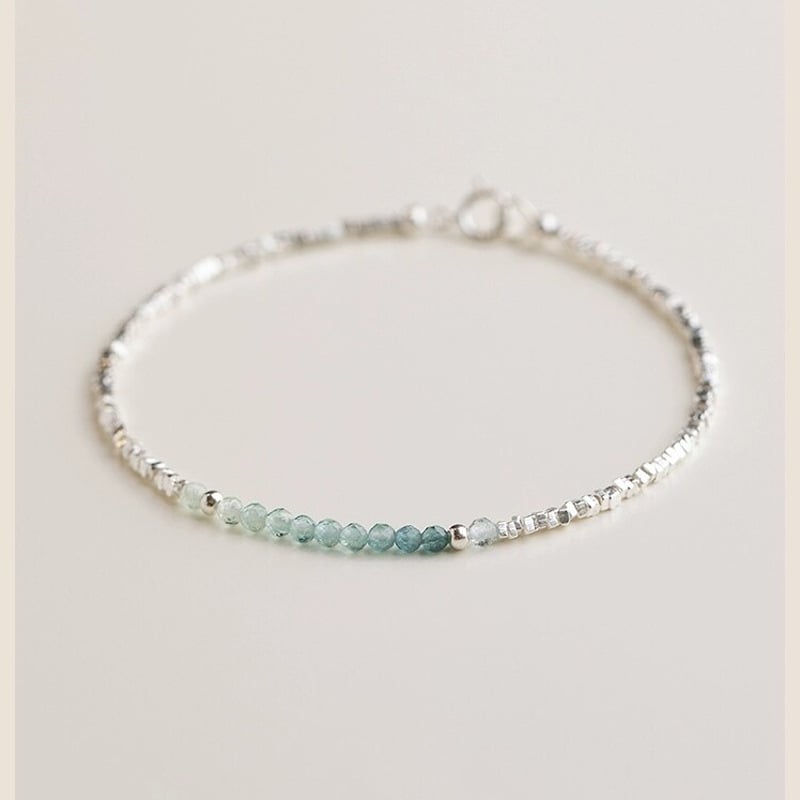 Akvamarin köves karkötő, geometriai design, elektroplattolt felület, női divat