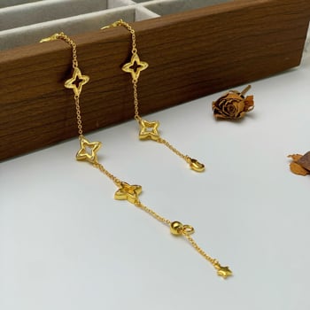 Női vintage karkötő csillag és négylevelű lóhere motívumokkal, aranyozott kivitel, Seiko technika, kézre való kiegészítő