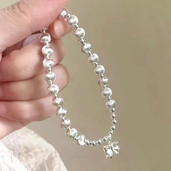 Virágmotívumos, kerek gyöngyökkel és masni fityegővel készült karkötő, réz, elektroplakálás, koreai stílusú nőknek, kézműves ékszer, 2024 tavasz