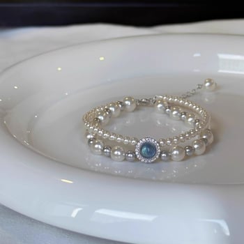 Kétszínű rétegű gyöngy karkötő, geometriai mintával a Mother buddha márkától, nőknek, könnyű luxus stílus (Anyag: gyöngy; Feldolgozás: elektroplattálás; Stílus: nők)