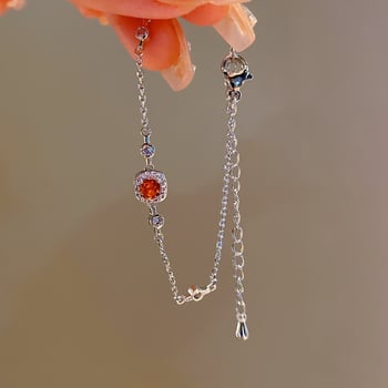 Négyszög alakú karkötő fényes dizájnnal; réz alapanyag; valódi arany bevonat; női, koreai stílus; Qiao xiya márka.