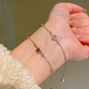 Négyszög alakú karkötő fényes dizájnnal; réz alapanyag; valódi arany bevonat; női, koreai stílus; Qiao xiya márka.