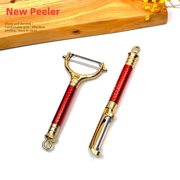 Viacúčelová škrabka na ovocie a zeleninu zo nehrdzavejúcej ocele, ABS plast, kreatívny štýl, uvedenie na trh 2025.