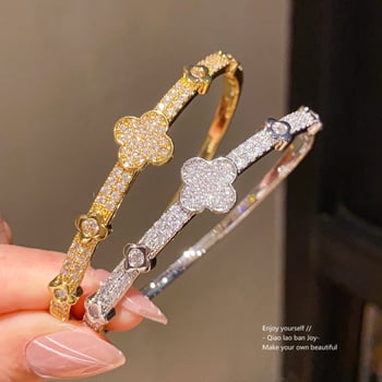 Virágdíszes csattal ellátott karkötő, 18K aranyozott cirkon, réz anyag, súly 11,7 g