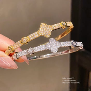 Virágdíszes csattal ellátott karkötő, 18K aranyozott cirkon, réz anyag, súly 11,7 g