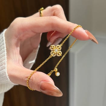 Női karkötő rézötvözetből, virágmotívummal és négylevelű lóherével, elektroplattálás, könnyed luxus stílus, 2025 tavasz