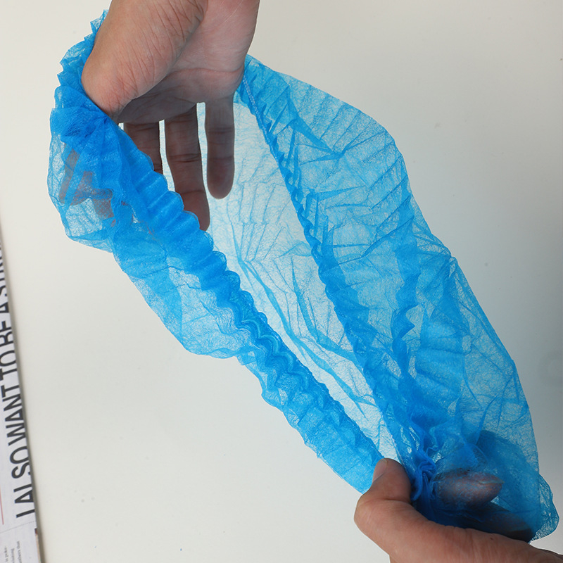 Jednokratna kapa za kosu od netkanog materijala s trakom, higijenska zaštita od prašine i ispadanja kose, tuš kapa s dvostruko ojačanim kupolom; Materijal: netkani materijal; Težina: oko 2,7 g; Jednokratna: Da; Personalizacija ispisa: Da; Privatna oznaka: 