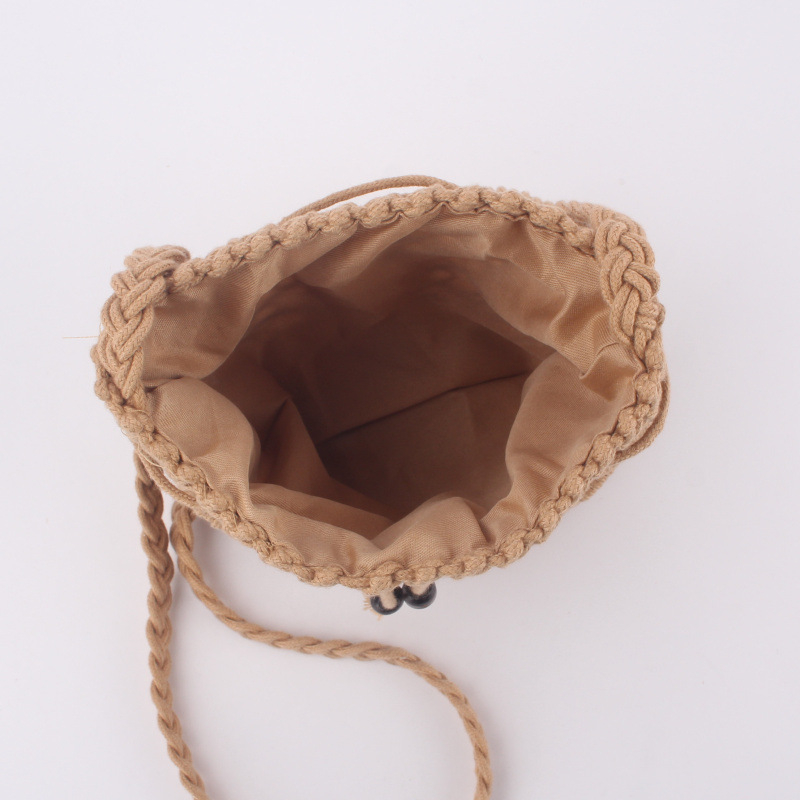 Geantă crossbody țesută manual din fir de bumbac, cu aspect din pai, formă cilindrică