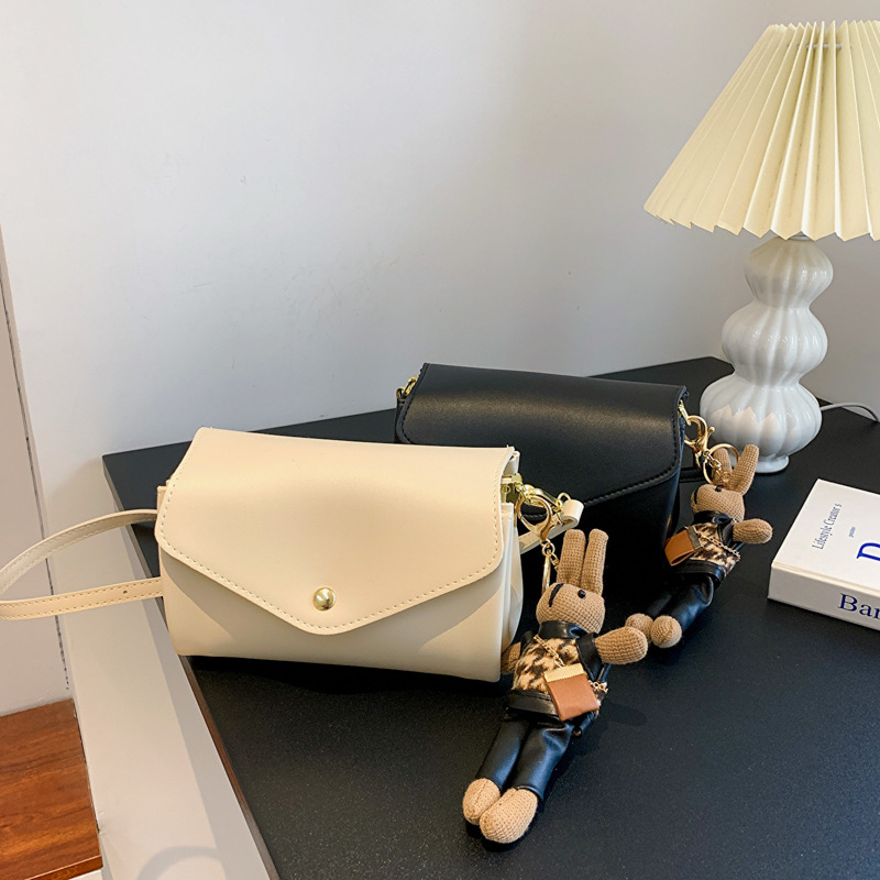 Ženska cilindrična torba od PU-a, street style, magnetsko zatvaranje, unutarnje džepove za telefon i ziptorbu, horizontalni kvadratni oblik