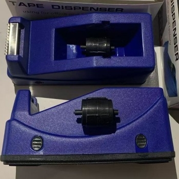 Plastični stolni držač trake s rezačem; model: držač trake za uredske potrebe; širina trake do 18 mm; promjer osovine trake 2,5 cm