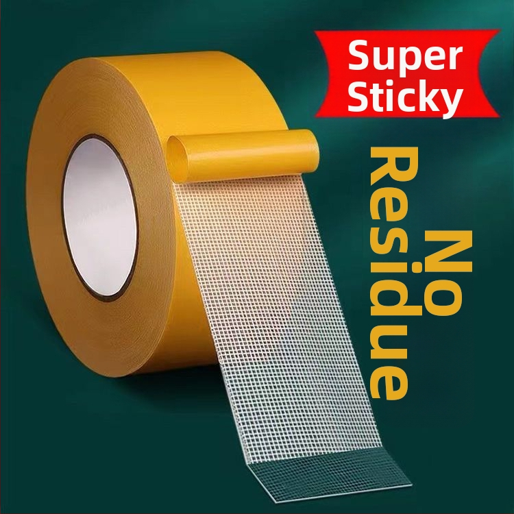 Dvojstranná lepiaca páska s textilnou základňou, priehľadná, vysoká viskozita, bez šmúh, s mriežkovanou štruktúrou, pre koberce a podložky