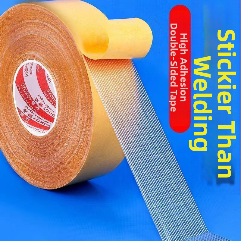 Dvojstranná lepiaca páska s textilnou základňou, priehľadná, vysoká viskozita, bez šmúh, s mriežkovanou štruktúrou, pre koberce a podložky