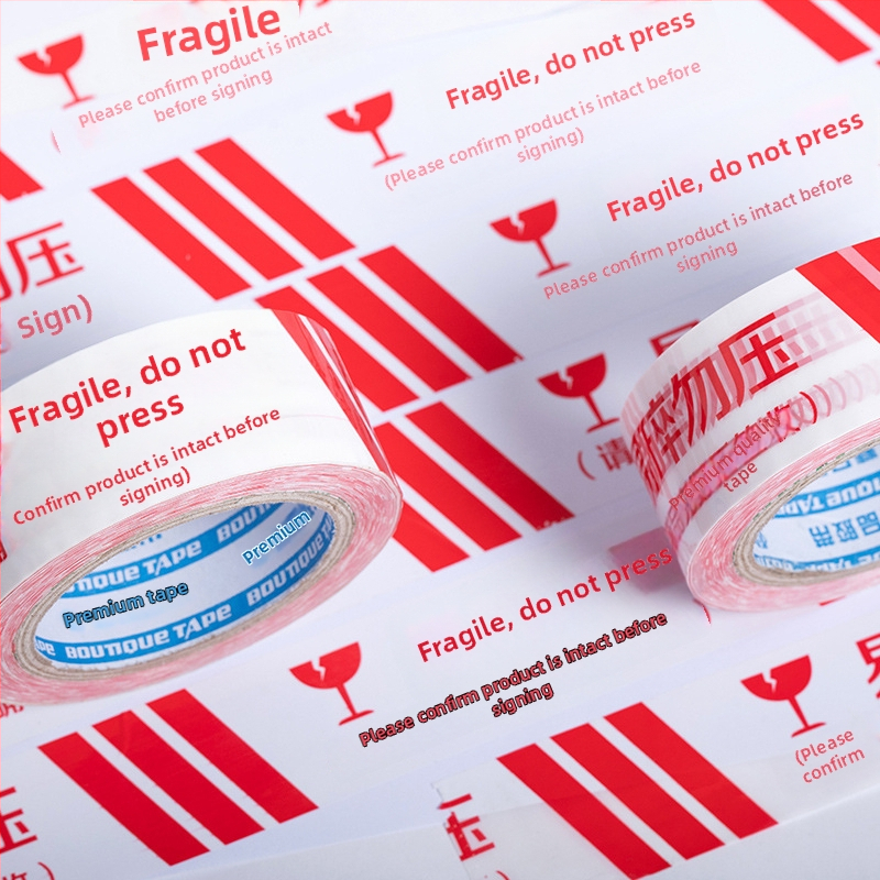 Páska s varovným označením Fragile, BOPP film, hrúbka 52 µm, lepidlo na báze vody, 1 rolka, určená na uzatváranie a balenie