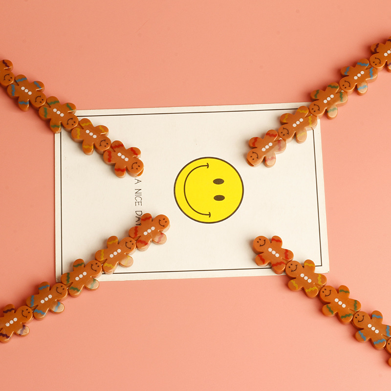 Olovka u obliku lutke, preklopna, s motivom keksa, plastičan omotač