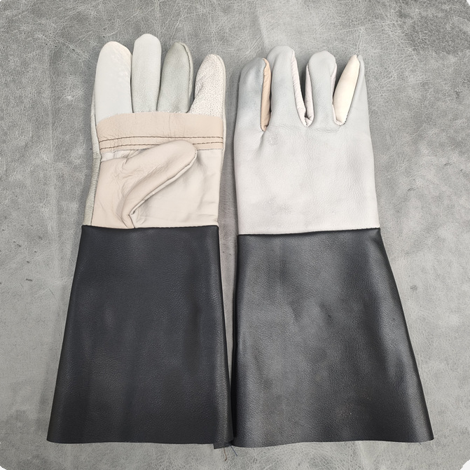 Zváracie rukavice z teľacej kože, odolné voči opotrebeniu, tepelno-izolačné, proti popáleninám, ohňovzdorné; dĺžky 38/26 cm; na zváranie