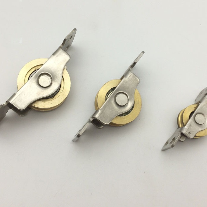 Roți pentru uși glisante de dulap de bază (Material: Cupru; Model: Roți pentru uși glisante de dulap de bază; Aplicație: role pentru uși și ferestre; Stil: Simplitate modernă)