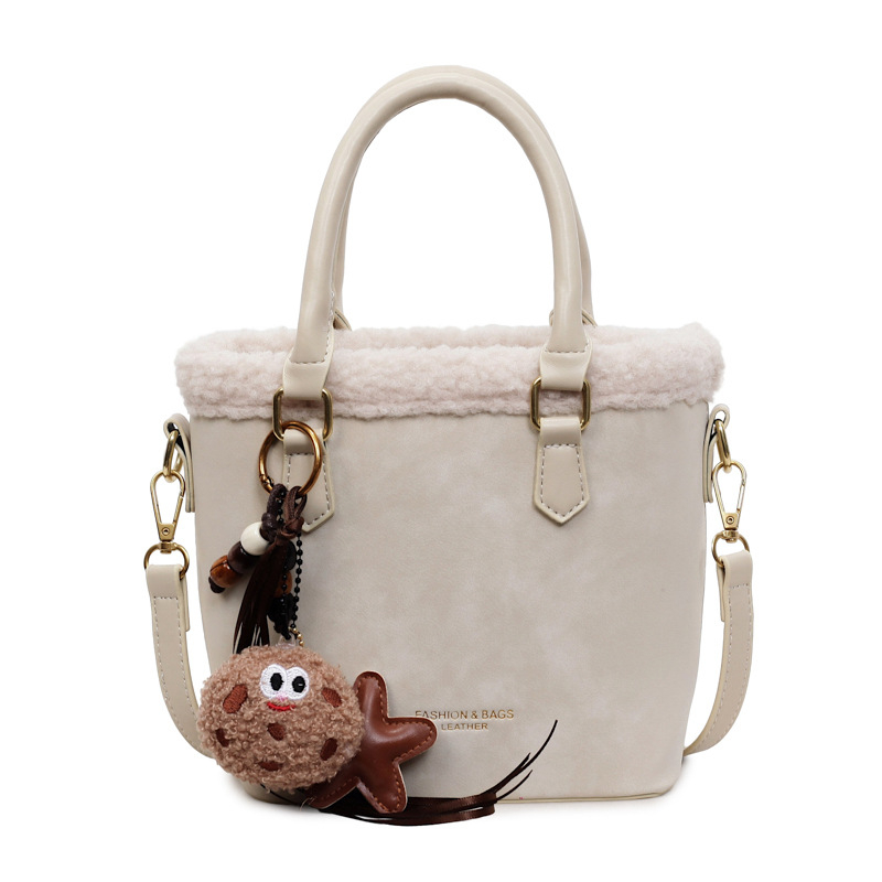 Crossbody torba od PU, oblik kante, zatvaranje na zip, jedna naramenica