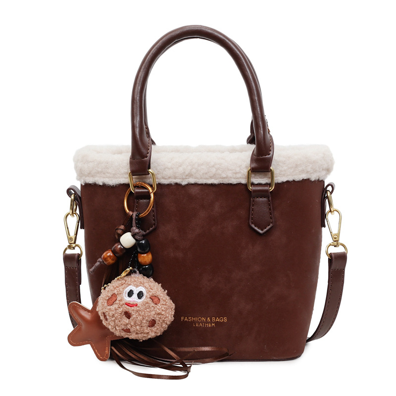 Crossbody torba od PU, oblik kante, zatvaranje na zip, jedna naramenica