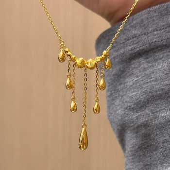 Ogrlica s mačjim okom, resice i kapljica u obliku suze, križni lanac, lagani luksuz