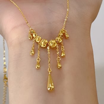 Ogrlica s mačjim okom, resice i kapljica u obliku suze, križni lanac, lagani luksuz