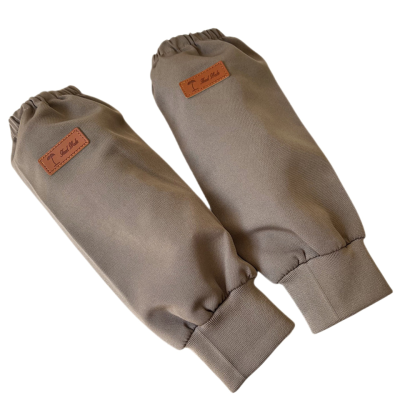 Ujjakkal ellátott vízálló kötény, poliészter, univerzális szabás, egyszínű minta