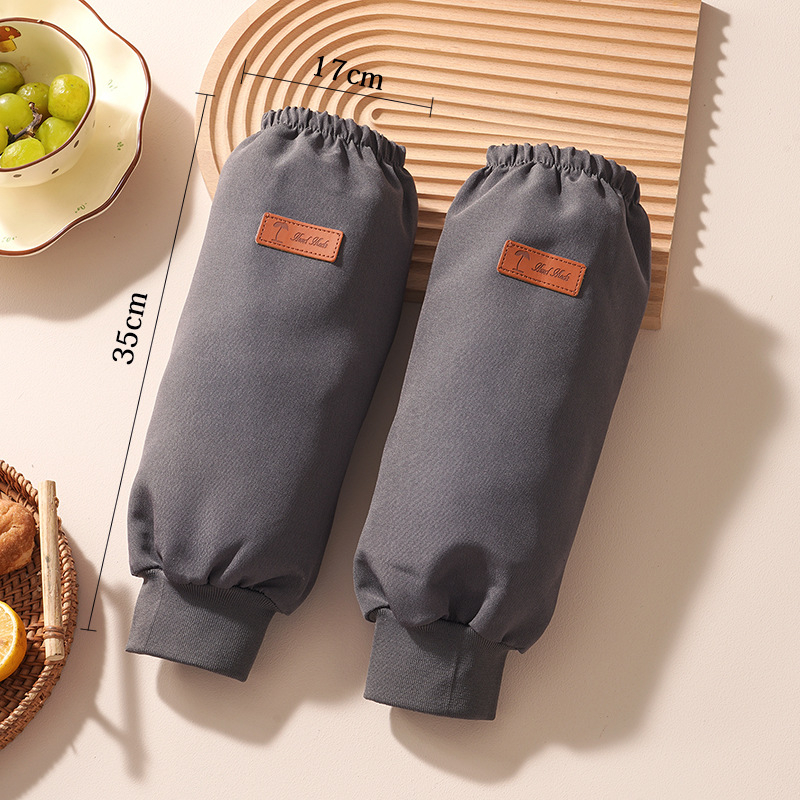 Ujjakkal ellátott vízálló kötény, poliészter, univerzális szabás, egyszínű minta