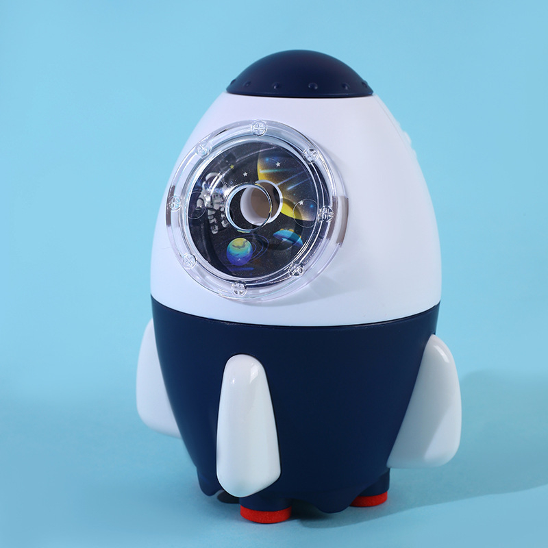 Elf 18127 — ascuțitoare de creioane manuală, ABS, formă rachetă-astronaut automobil