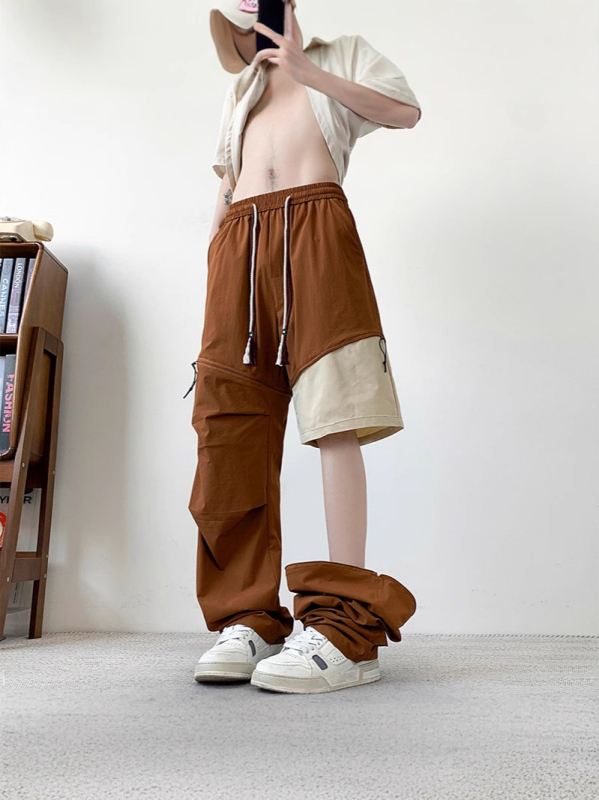 Pantaloni cargo, croială lejeră, talie medie, cu numeroase buzunare și elemente detașabile; material din nylon-spandex (90% nylon, 10% spandex)