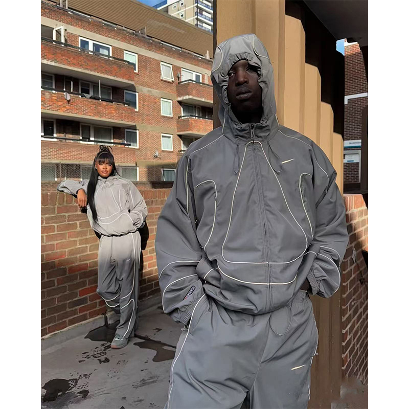 Alcatraz suradnja jakna s izvezenim logom, unisex široki kroj, kapuljača, zip, reflektirajuće trake, model 25002