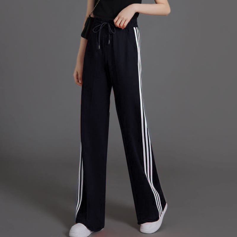 Női magas derekú, enyhén szélesedő sportnadrág három csíkkal, viszkóz szálas anyagból