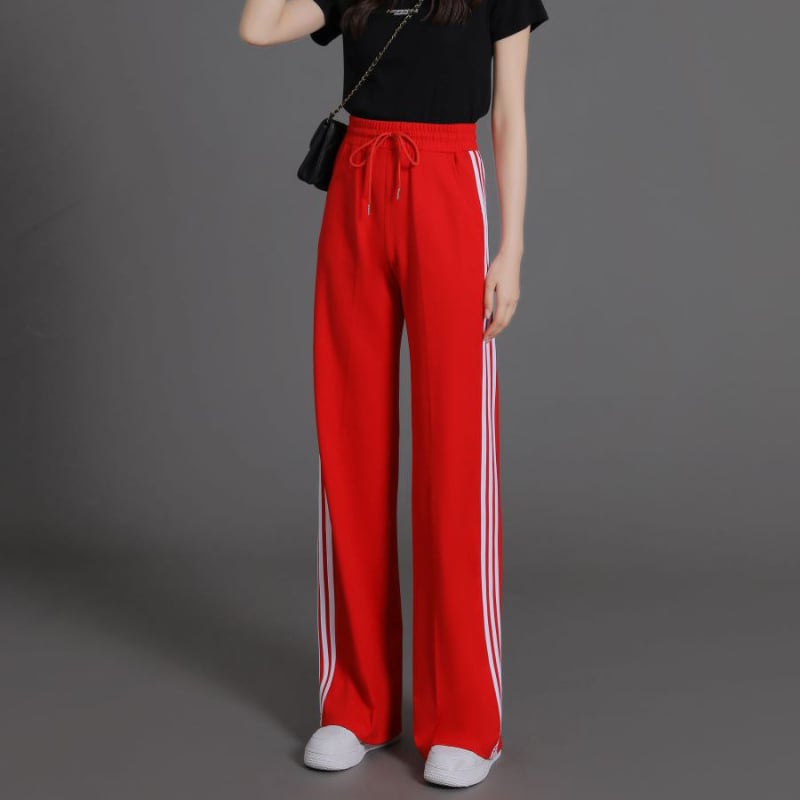 Női magas derekú, enyhén szélesedő sportnadrág három csíkkal, viszkóz szálas anyagból