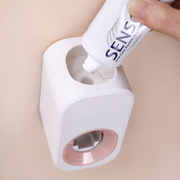 ABS műanyagból készült fogkrémnyomó, falra szerelhető szívókorongos rögzítéssel és levehető tárolóval