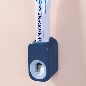 ABS műanyagból készült fogkrémnyomó, falra szerelhető szívókorongos rögzítéssel és levehető tárolóval