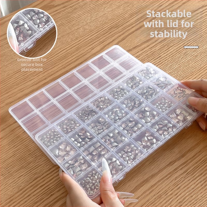 Cutie transparentă cu 28 compartimente pentru depozitarea unghiilor și a bijuteriilor, capac sigilat cu clapă, din rășină