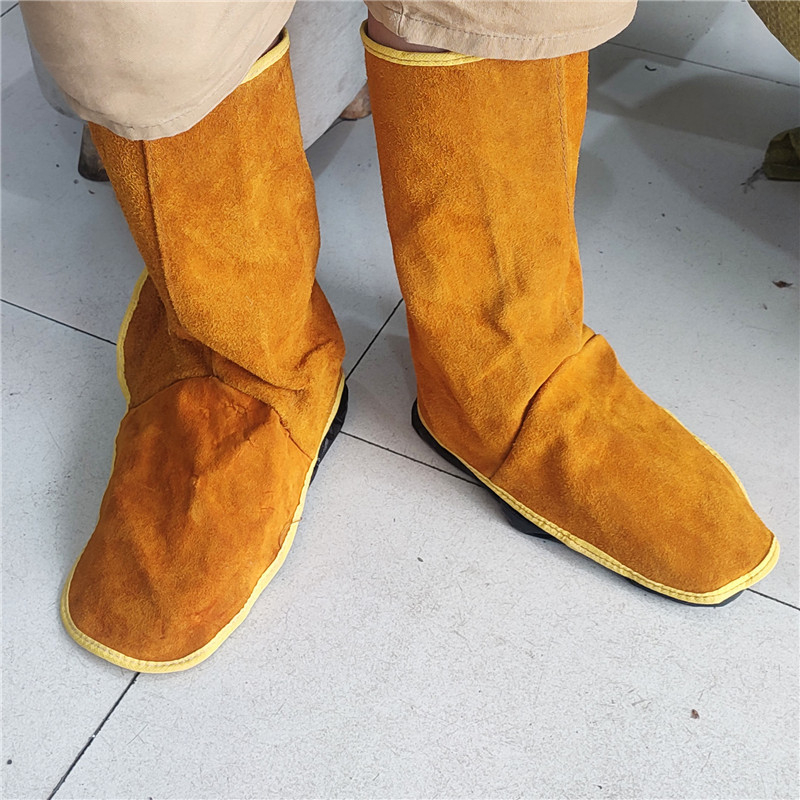 Καλύμματα προστασίας παπουτσιών συγκόλλησης, δέρμα βοδιού με φλίς, παχύτερη μόνωση κατά της καύσης, προστασία ποδιού και κνήμης κατά την ηλεκτροσυγκόλληση