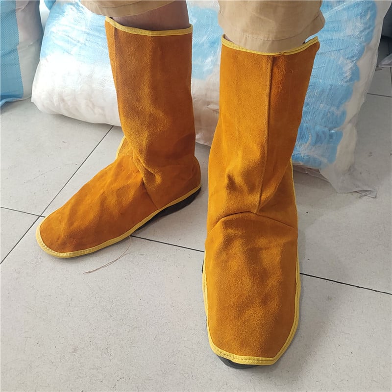 Καλύμματα προστασίας παπουτσιών συγκόλλησης, δέρμα βοδιού με φλίς, παχύτερη μόνωση κατά της καύσης, προστασία ποδιού και κνήμης κατά την ηλεκτροσυγκόλληση